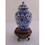 A Chinese blue and white baluster vase with raised pull off cover, the sides decorated with