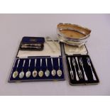 A quantity of silver to include a shaped oval bowl, a cased set of enamel spoons, cased flatware and