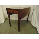 An Edwardian rectangular mahogany drop flap table with single drawer on four tapering rectangular