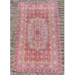Persian style wool red ground prayer rug with repeating geometric motif and border, 106 x 63cm, A/F