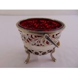 A continental white metal sugar bowl, scroll and bar pierced sides with beaded borders and swing