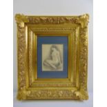 A framed and glazed monochromatic pencil sketch of a seated female nude, 24.5 x 18cm