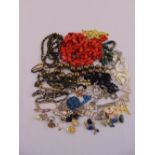 A quantity of costume jewellery to include necklaces, bracelets, earrings and brooches