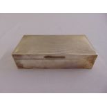 A rectangular silver engine turned cigarette box with hinged cover and cedar wood lining, Birmingham