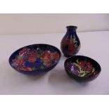 Moorcroft Hibiscus pattern a fruit bowl, a dish and a matching vase