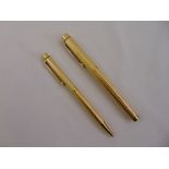 A Sheaffer gold plated fountain pen with 14ct gold nib and a Sheaffer gold plated ballpoint pen