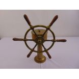 A Brown Bros of Edinburgh Rosebank brass and wooden ships wheel of customary form