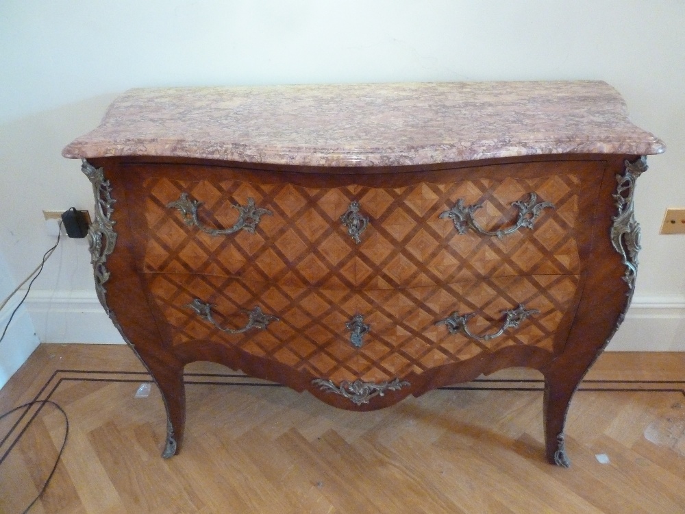 A French Louis XVI style kingswood chest of drawers with detachable marble top with gilded metal