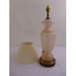 A pink frosted glass table lamp with silk shade