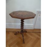 An inlaid side table with octagonal top on barley twist support with outswept legs
