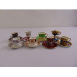 Eight various cabinet cups and saucers, two with silver mounts by various makers to include