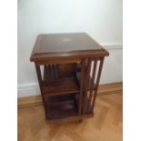 An Edwardian mahogany inlaid revolving rectangular book stand