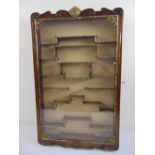 An oriental rectangular glazed display wall cabinet with key