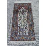 Persian style wool runner with repeating floral design against a cream and tan ground, 143 x 69cm