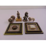 A quantity of white metal figurines to include framed models of Jerusalem, a lion and two others (
