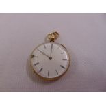 A 9ct gold open face pocket watch with white enamel dial and Roman numerals, approx total weight