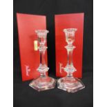 A pair of Baccarat cut glass table candlesticks of hexagonal form in original packaging
