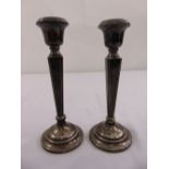 A pair of silver filled table candlesticks, Birmingham 1957