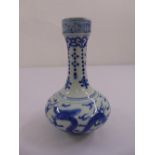 A Chinese blue and white stem vase decorated with dragons and bats