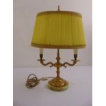 An onyx and gilded metal two branch table lamp with silk shade