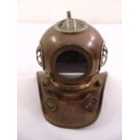 A miniature brass and bronze early divers helmet
