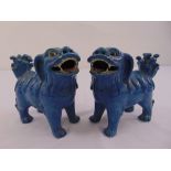 A pair of Chinese blue glazed Dogs of Foe figurines