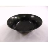 An oriental spinach green jade bowl of plain form with everted side