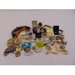 A quantity of costume jewellery to include brooches, necklaces, earrings and rings