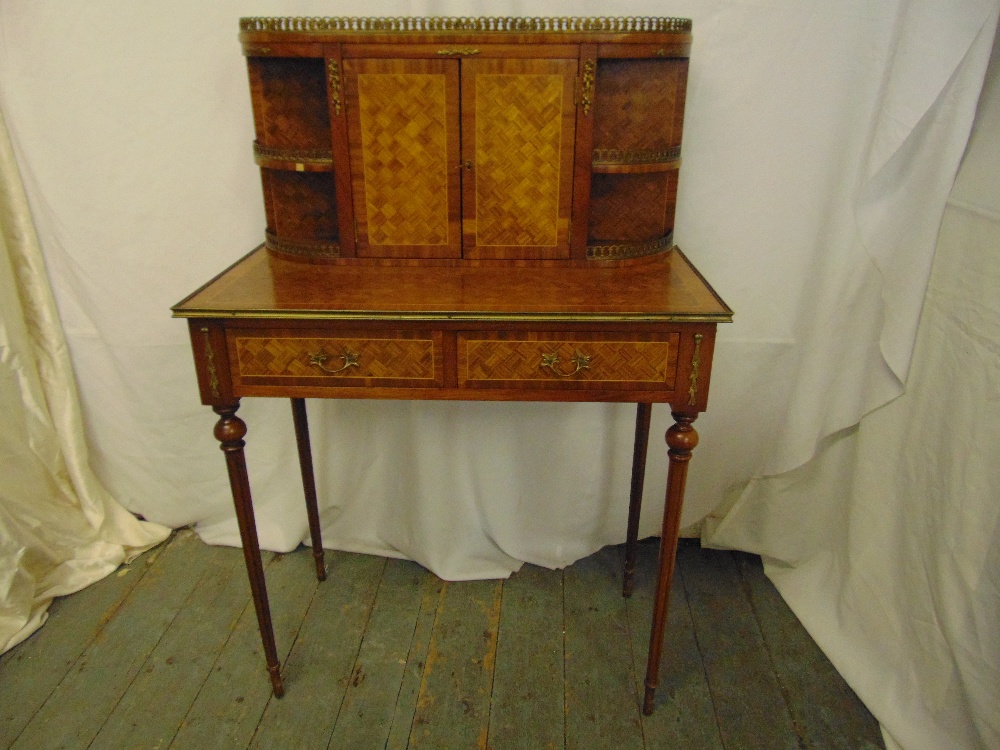 A French style rectangular bureau with brass mounts and galleried back section with two hinged