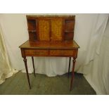 A French style rectangular bureau with brass mounts and galleried back section with two hinged