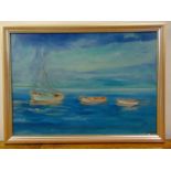 A framed oil on canvas of boats at sea, 50 x 70cm