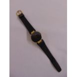 Christian Dior gold plated gentlemans dress watch with black dial on leather strap