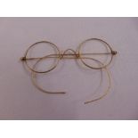 A pair of Bateman gold plated reading glasses