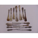 Seven silver handled shoehorns and eight silver handled button hooks