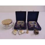 A quantity of silver to include cased condiment sets, a pair of dwarf candlesticks and a powder