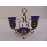 A continental gilt metal and porcelain table centre piece comprising a bowl and two vases