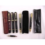 Three Parker Duofold fountain pens with 18ct gold nib, a matching propelling pencil, a ball point