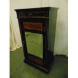 An Edwardian rectangular ebonised inlaid mahogany music cabinet with bevelled mirror to hinged
