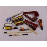 A quantity of pipes and cigarette holders of various form and shape (10)