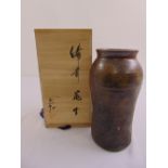 A Japanese brown glazed stoneware vase in presentation wooden box