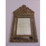A 19th century continental brass wall mirror with five mirrored panels