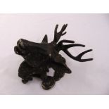 A cast metal wall ornament in the form of a bucks head