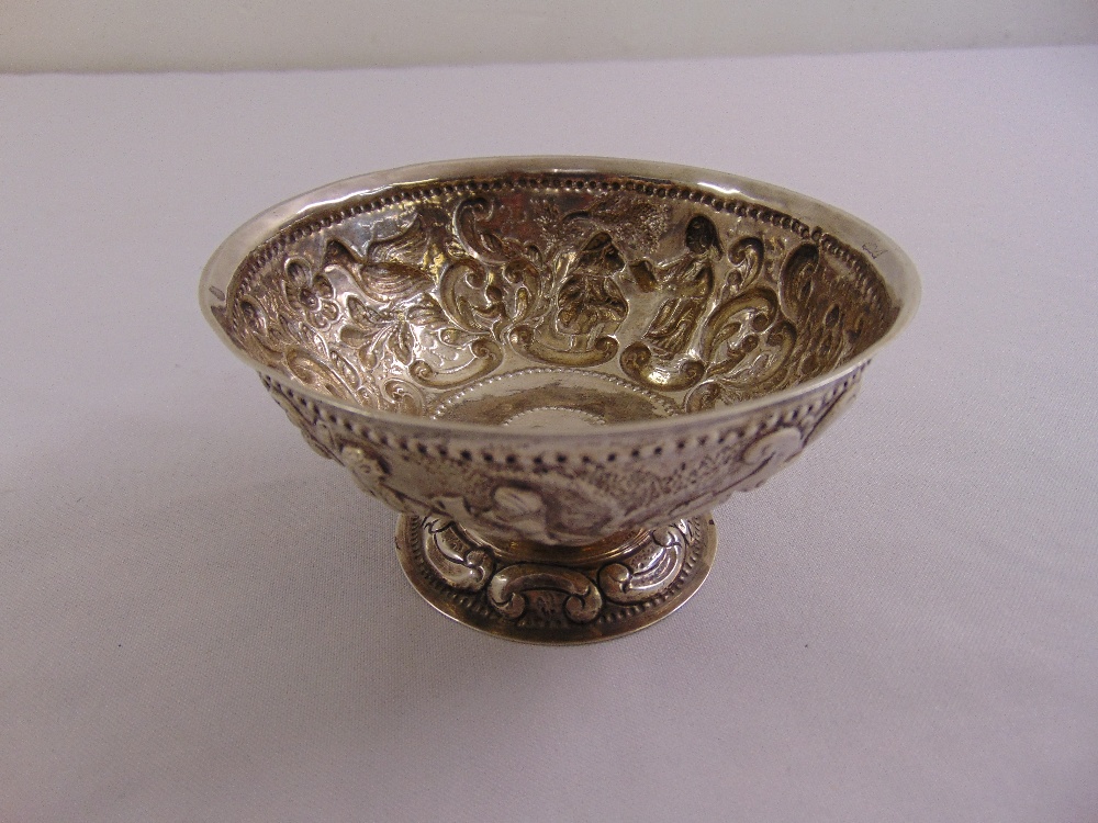 A Dutch late 18th century circular silver bowl the sides chased with figures, animals, leaves and