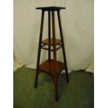 A mahogany arts and crafts plant stand, the square sections with rectangular supports
