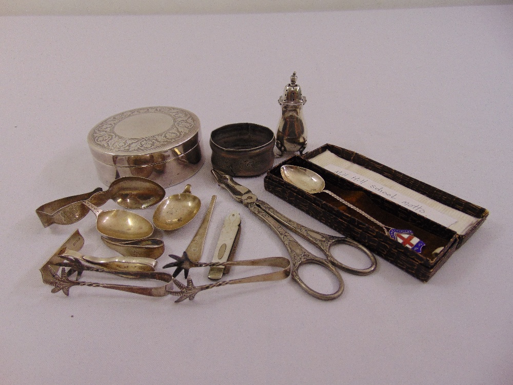 A quantity of silver and white metal to include ice tongs, a fruit knife and a cased souvenir spoon