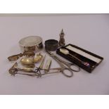 A quantity of silver and white metal to include ice tongs, a fruit knife and a cased souvenir spoon