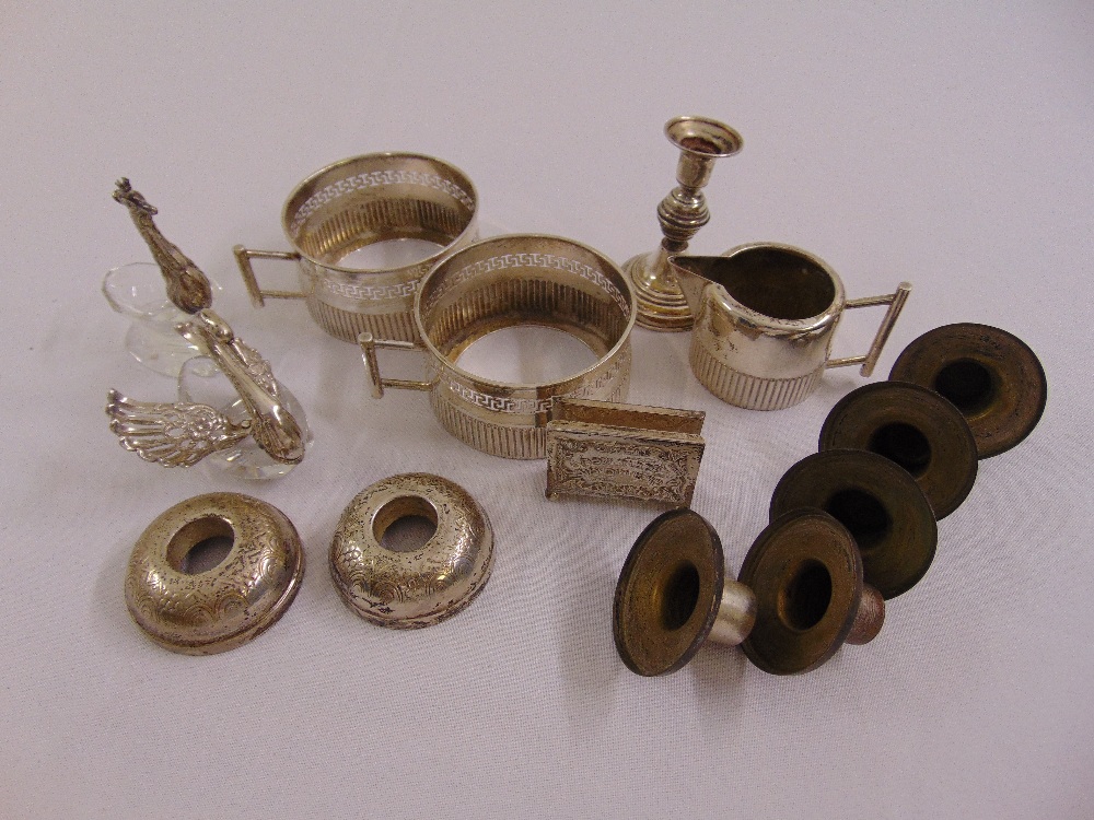 A quantity of silver and white metal to include a cream jug and a pair of tea glass holders