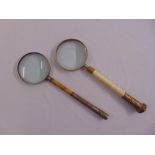 Two magnifying glasses, one with bone and gilt metal mounts, the other with white metal chased