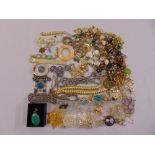 A quantity of costume jewellery to include earrings, necklaces, brooches and bracelets
