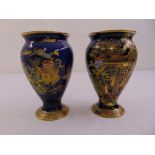 A pair of Carltonware Chinoiserie pattern baluster vases with everted rims and raised circular